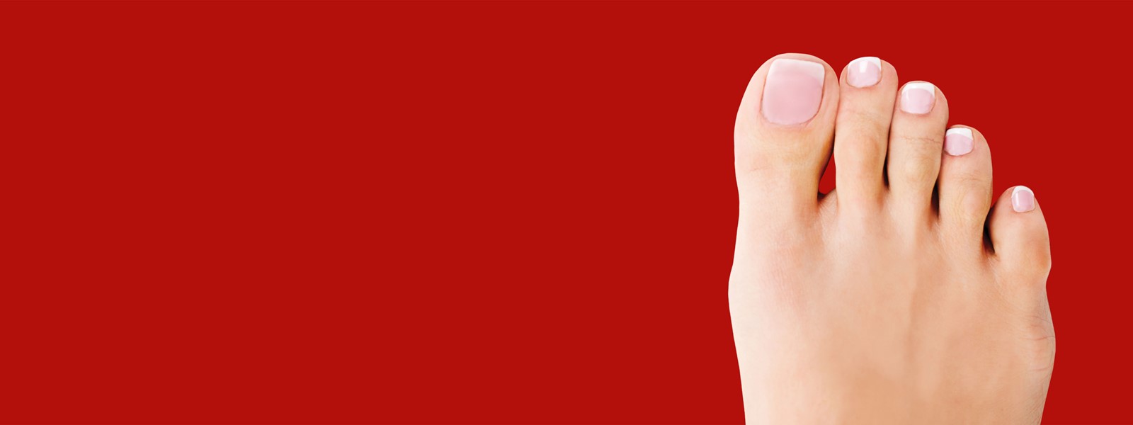 Header photo with a bare foot and a red background
